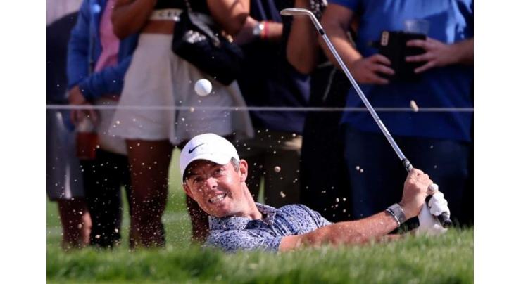 McIlroy comes through 'battle' to edge bitter rival Reed in Dubai

