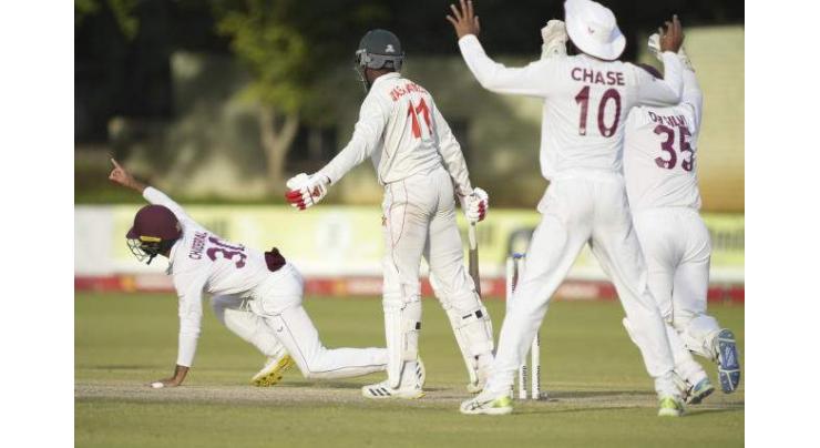 Zimbabwe survive Ballance blow to draw with W.Indies
