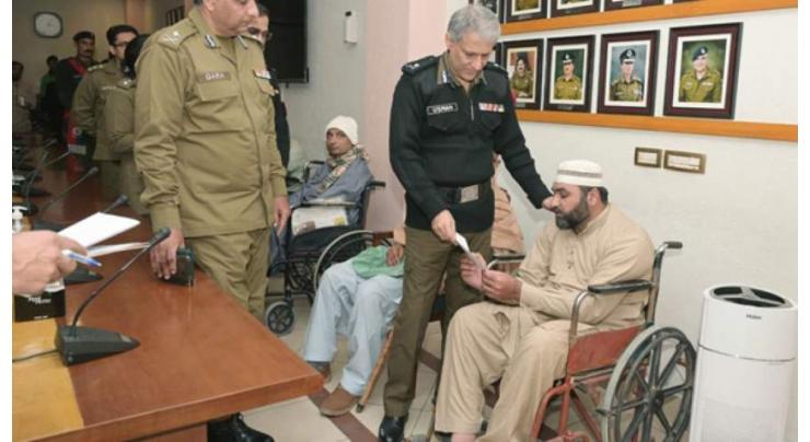 Relief cheques distributed among incapacitated Ghazis of police
