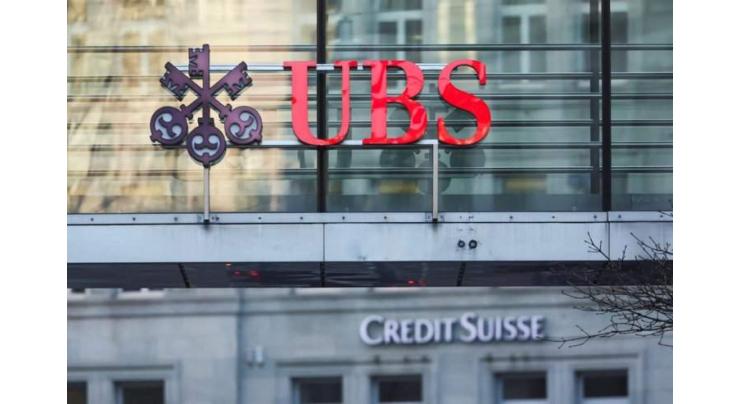 Bank shares slide despite Credit Suisse buyout
