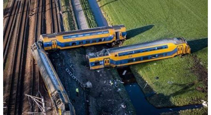 One dead, many hurt as Dutch train hits crane
