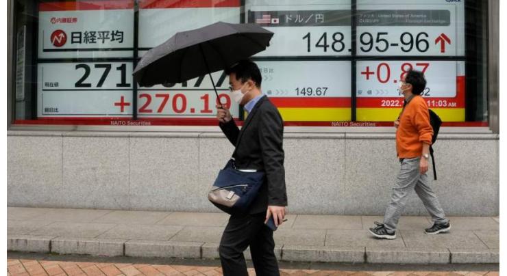 Asian markets swing as inflation, rates worry investors
