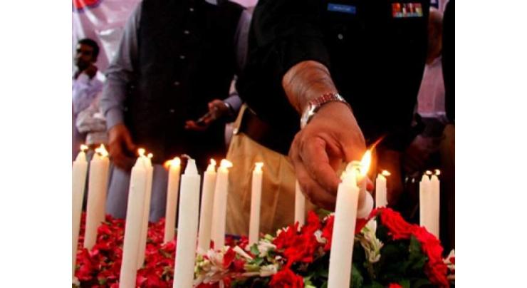 Police organizes candle lighting ceremony to pay tribute to martyrs
