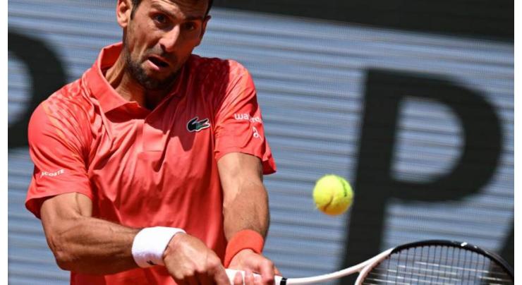 Djokovic battles into French Open second round, Alcaraz waits
