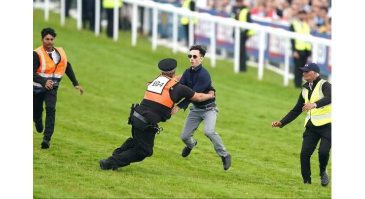 UK police swoop on activists as protester invades Epsom Derby
