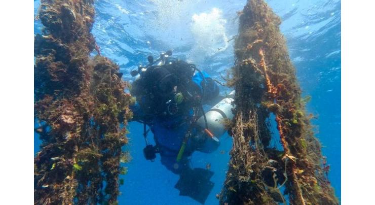 Divers fish deadly 'ghost nets' from Santorini's depths

