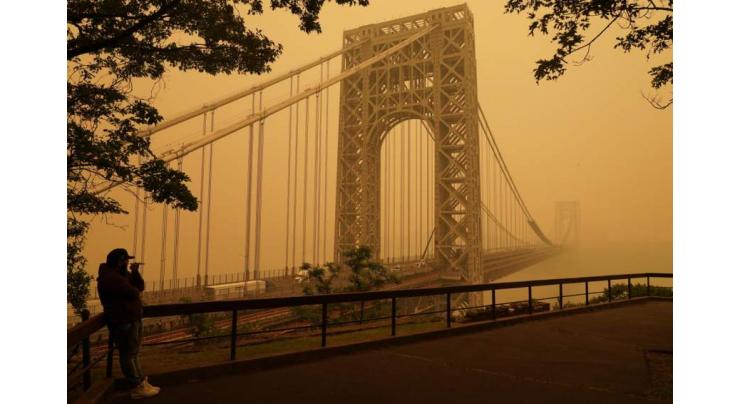 US cities shrouded in toxic haze as reinforcements reach Canada wildfires
