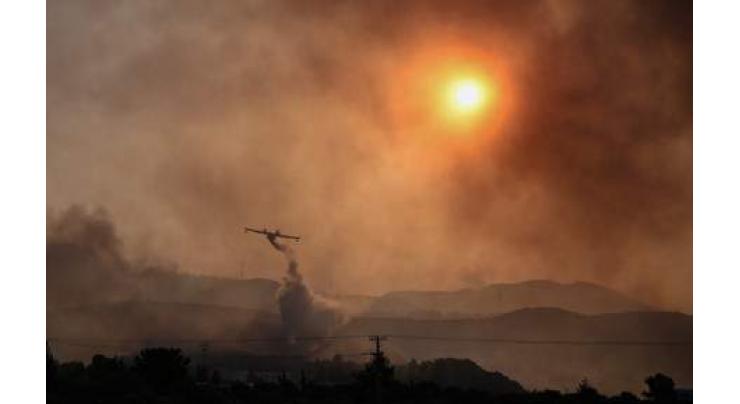 New fires in heat-hit Greece force evacuations

