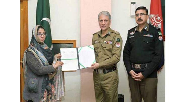 IG Punjab Dr. Usman Anwar distributes ownership documents of plots to families of police martyrs
