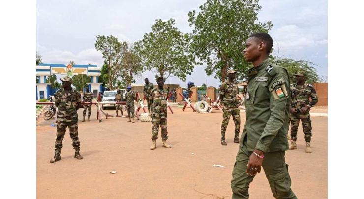 African Union suspends Niger over coup as 12 troops die in new attack
