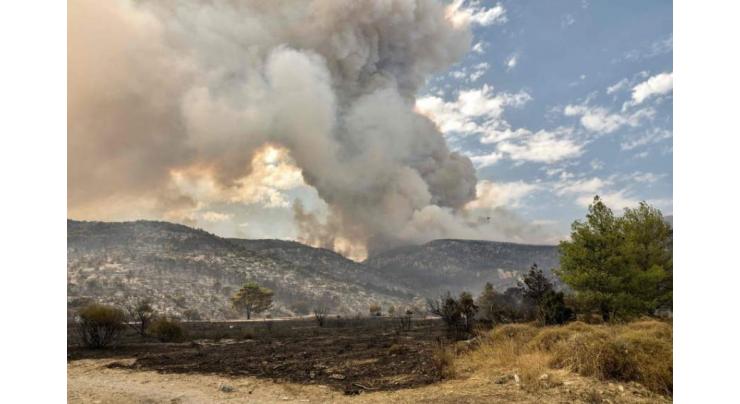 Greece struggles to tame wildfires raging for a sixth day
