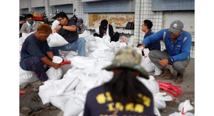 Taiwan cancels flights, shuts schools ahead of typhoon