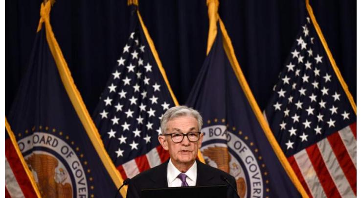 US Fed holds key rate steady and signals three cuts likely in 2024