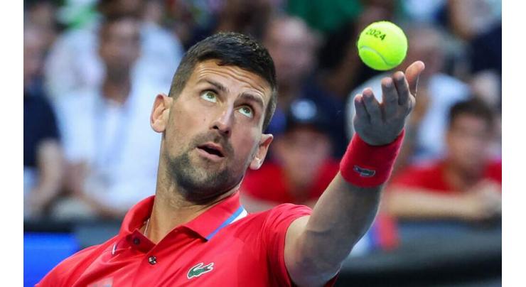 Injury worries for Djokovic, Tsitsipas as Serbia squeeze into quarters