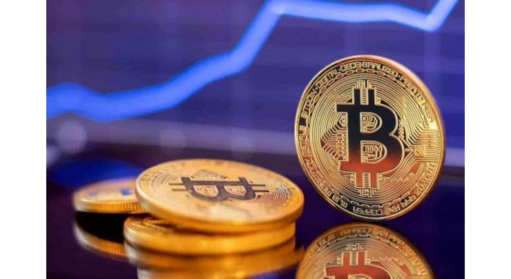 Bitcoin strikes record high above $69,000