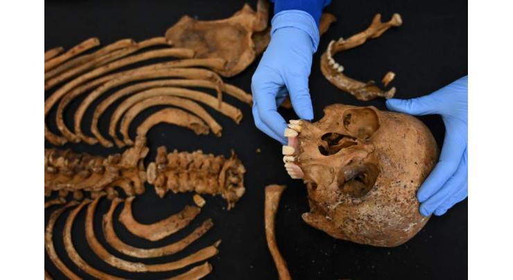 Buried clothes, bones and DNA help identify Colombia's missing