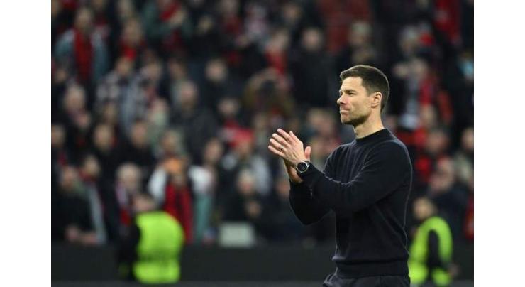 Liverpool target Xabi Alonso says staying as Leverkusen coach
