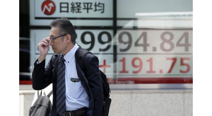 Asian markets hit by dimming US rate hopes, Taiwan quake