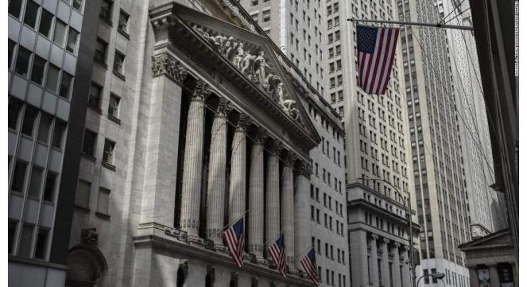 Wall Street shrugs off strong jobs data