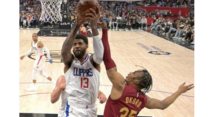 George late show sparks Clippers over Cleveland