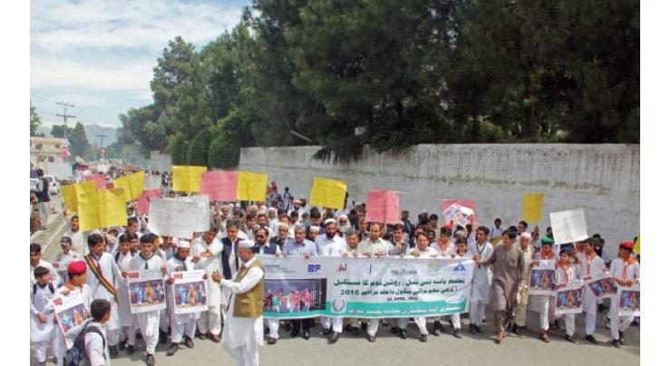 Enrolment campaign, awareness walk held in Lower Chitral