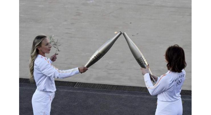 Greece hands Olympic flame to 2024 Paris Games hosts