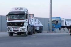 Aid trucks begin moving from Rafah Crossing toward ..