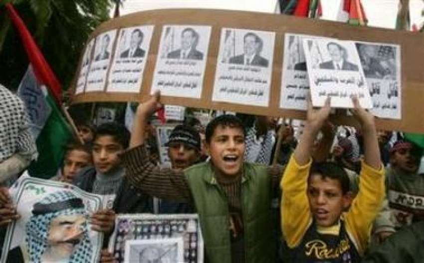 غزہ،فلسطینی بچے صدام حسین کے حق میں‌ مظاہرہ کر رہے ہیں۔