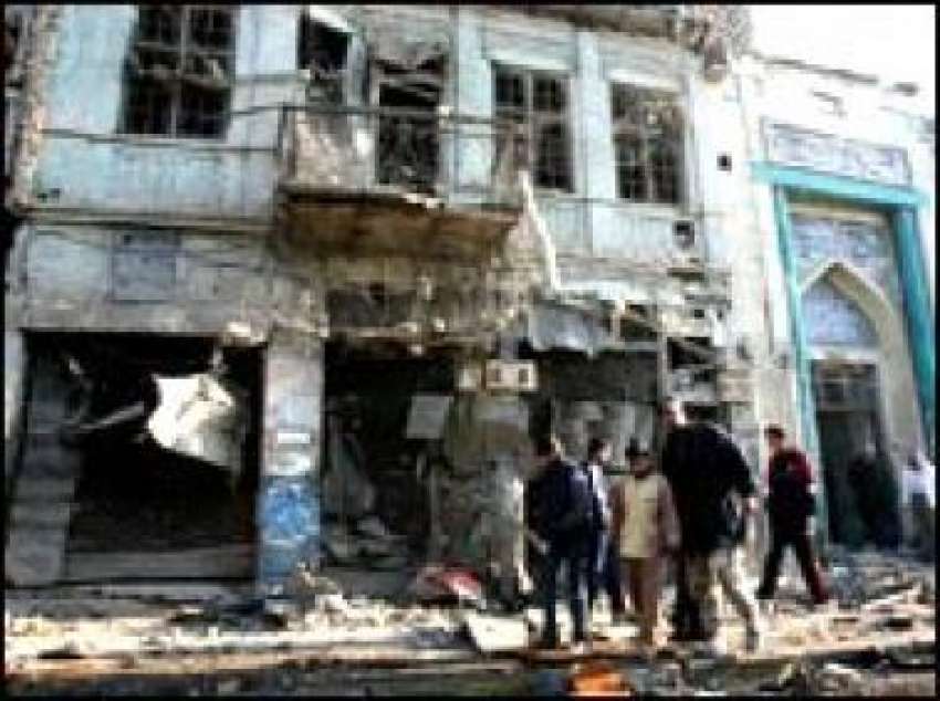 بغداد ،کار بم دھماکے سے تباہ ہونے والی بلڈنگ کا منظر۔