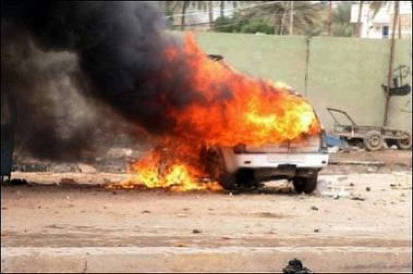 کربلا،خودکش حملہ کے بعد گاڑی میں آگ لگا ہوئی ہے۔