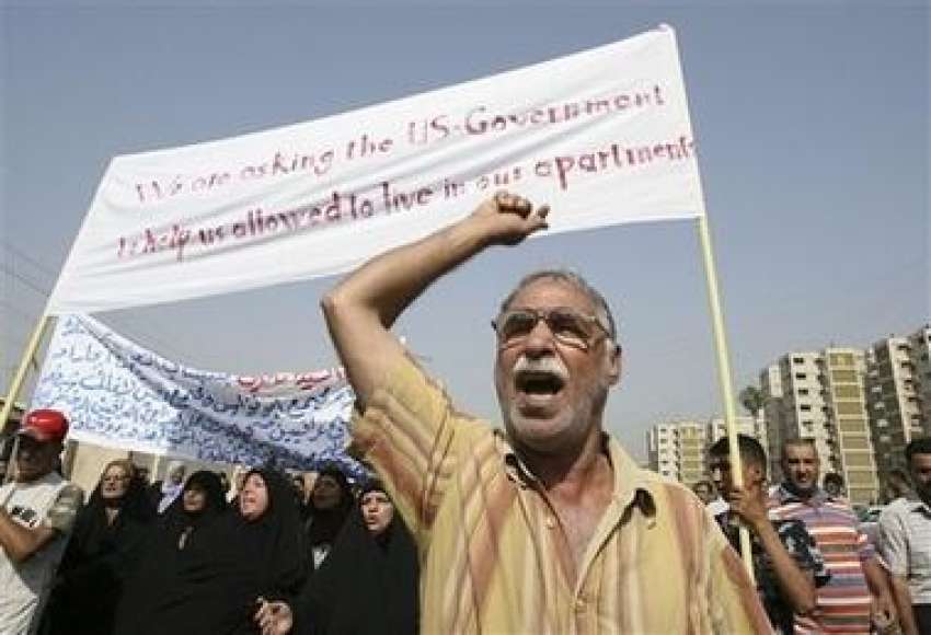 بغداد،عراقی شہری ایک مظاہرے کے دوران امریکی اور اتحادی ..