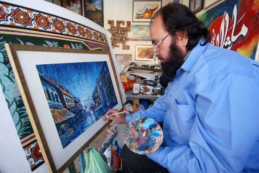 اسلام آباد: ایک آرٹسٹ لوک ورثہ میں پینٹنگ بنانے میں مصروف ..