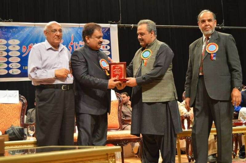 A Shield Is Being Presented To Abbas Tabish After Abu Dhabi Mushaira 2015